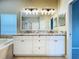 Primary bathroom featuring dual sinks, granite countertops, a bathtub, and a separate glass door shower at 1919 Oswego Dr, Holiday, FL 34691