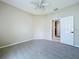 Spacious bedroom with a ceiling fan, neutral carpet and a convenient closet at 1919 Oswego Dr, Holiday, FL 34691
