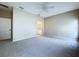 Large bedroom with neutral carpet and an open door to the bathroom at 1919 Oswego Dr, Holiday, FL 34691