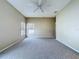 Bedroom with neutral carpet, ceiling fan, and two windows with blinds at 1919 Oswego Dr, Holiday, FL 34691