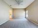 Large bedroom with carpet and a view to the ensuite bathroom at 1919 Oswego Dr, Holiday, FL 34691