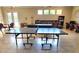 Clubhouse showing a ping pong table, pool table, and several table and chair groupings at 1919 Oswego Dr, Holiday, FL 34691