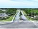 Scenic aerial view of a community entrance with lush landscaping and serene water features at 1919 Oswego Dr, Holiday, FL 34691