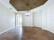 Dining room featuring wood floors, neutral paint, and modern lighting at 1919 Oswego Dr, Holiday, FL 34691