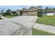 Charming single-Gathering home featuring a three-car garage and well-manicured lawn at 1919 Oswego Dr, Holiday, FL 34691