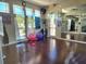 Spacious fitness center with floor to ceiling mirrors, exercise balls and rubberized wood floor at 1919 Oswego Dr, Holiday, FL 34691