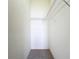 Walk-in closet with carpet and wire shelving providing ample storage space for organizing clothes and accessories at 1919 Oswego Dr, Holiday, FL 34691