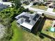 Charming home equipped with solar panels and serene water views is perfect for nature lovers at 21626 Rosewood Ct, Lutz, FL 33549