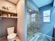 Bathroom featuring a modern shower and shelving for storage and decoration at 21626 Rosewood Ct, Lutz, FL 33549
