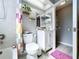 Bathroom featuring a tub, shower, and toilet with colorful accents and decor at 21626 Rosewood Ct, Lutz, FL 33549