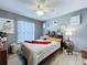 Bright bedroom with modern décor and light-colored wood flooring at 21626 Rosewood Ct, Lutz, FL 33549