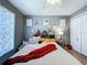 Bedroom featuring closet, ceiling fan, window and modern decor at 21626 Rosewood Ct, Lutz, FL 33549