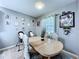 A dining area bathed in natural light, features a wooden table and chairs, with décor at 21626 Rosewood Ct, Lutz, FL 33549