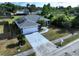 Aerial view of attractive home with a well-manicured front lawn and a long driveway to a 2 car garage at 21626 Rosewood Ct, Lutz, FL 33549
