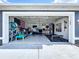 Spacious garage providing ample storage and workout space with an American flag at 21626 Rosewood Ct, Lutz, FL 33549