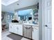 Kitchen featuring white cabinets and stainless steel appliances at 21626 Rosewood Ct, Lutz, FL 33549