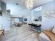 Open-concept living room featuring wood floors and vaulted ceilings at 21626 Rosewood Ct, Lutz, FL 33549