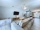 Bright living room boasts an open layout, vaulted ceilings, and modern decor at 21626 Rosewood Ct, Lutz, FL 33549