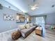 Cozy living room with vaulted ceilings, modern flooring, and an open layout perfect for Gathering gatherings at 21626 Rosewood Ct, Lutz, FL 33549