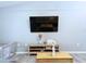Living room featuring a mounted TV and modern décor at 21626 Rosewood Ct, Lutz, FL 33549