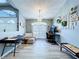 Sitting room featuring a chandelier and grey wood floors at 21626 Rosewood Ct, Lutz, FL 33549