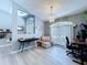 Comfortable sitting room with a chandelier and a view of the front door at 21626 Rosewood Ct, Lutz, FL 33549
