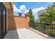 Balcony offers tiled floors, views of landscaping, and dark metal railings at 2221 Soho Bay Ct, Tampa, FL 33606