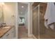 Bathroom featuring a granite vanity and a view of the bedroom from the doorway at 2221 Soho Bay Ct, Tampa, FL 33606