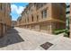 Townhouse exterior featuring brick paving, garages, and beautiful landscaping at 2221 Soho Bay Ct, Tampa, FL 33606