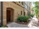 Inviting townhouse front door with brick paved walkway and lush landscaping at 2221 Soho Bay Ct, Tampa, FL 33606