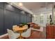 Cozy living room showcasing dark accent wall, wood floors, and comfortable seating at 2221 Soho Bay Ct, Tampa, FL 33606
