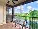 Cozy balcony with golf course views, complete with charming seating and tranquil ambiance at 2400 Feather Sound Dr # 635, Clearwater, FL 33762