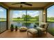 Relaxing balcony featuring a lounge chair, dog bed, and tranquil golf course views at 2400 Feather Sound Dr # 635, Clearwater, FL 33762
