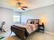 Bedroom features a ceiling fan, exercise bike, and a window with lots of light at 2400 Feather Sound Dr # 635, Clearwater, FL 33762