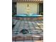 Three tiered fountain in a courtyard with decorative patterned tile flooring and turtle at 2400 Feather Sound Dr # 635, Clearwater, FL 33762