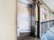 Exterior common area featuring a silver elevator, a level 3 building, and covered area at 2400 Feather Sound Dr # 635, Clearwater, FL 33762