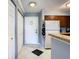 Entryway featuring an exterior door, tile floor, and closet at 2400 Feather Sound Dr # 635, Clearwater, FL 33762