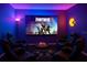 Immersive game room with comfortable chairs, neon lighting, and large TV screen providing the ultimate entertainment space at 2400 Feather Sound Dr # 635, Clearwater, FL 33762