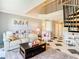 Comfortable living room featuring a spiral staircase and a cozy seating area at 2400 Feather Sound Dr # 635, Clearwater, FL 33762