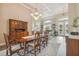Elegant dining room showcasing hardwood floors, coffered ceilings, and abundant natural light at 26701 Winged Elm Dr, Wesley Chapel, FL 33544