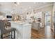 Bright kitchen with white cabinets, granite countertops, stainless steel appliances and breakfast bar at 26701 Winged Elm Dr, Wesley Chapel, FL 33544