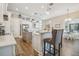 Updated kitchen with an island with pendant lights and bar seating, and stainless steel appliances at 26701 Winged Elm Dr, Wesley Chapel, FL 33544