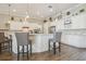 Spacious kitchen with white cabinets, marble countertops, stainless steel appliances, and pendant lighting at 26701 Winged Elm Dr, Wesley Chapel, FL 33544