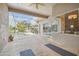 Large screened-in lanai with a view of the pool and spa, offering seamless indoor-outdoor living and dining spaces at 26701 Winged Elm Dr, Wesley Chapel, FL 33544
