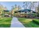 Community playground with shaded structures, climbing equipment, slides, and picnic tables at 26701 Winged Elm Dr, Wesley Chapel, FL 33544