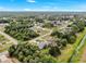 Scenic aerial view showcases the homes in the wooded community, lush landscape, and peaceful neighborhood at 2675 Cherokee St, North Port, FL 34286