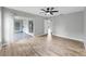 Bedroom features wood-look floors and sliding door to outdoor living space at 2675 Cherokee St, North Port, FL 34286