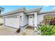 Charming single-story home exterior with a two-car garage, well-maintained landscaping, and inviting entrance at 2675 Cherokee St, North Port, FL 34286