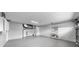 Spacious garage with painted floor and storage cabinets at 2675 Cherokee St, North Port, FL 34286