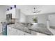 Kitchen area featuring bar seating with granite countertop and stainless steel appliances at 2675 Cherokee St, North Port, FL 34286